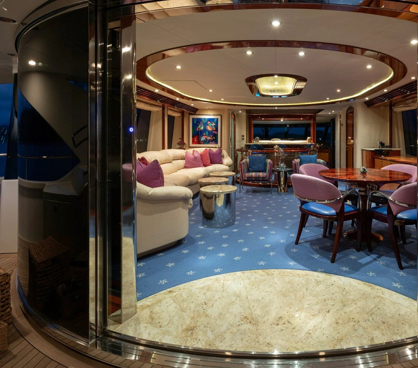a large room with a glass wall aboard DRIVEN Yacht for Sale