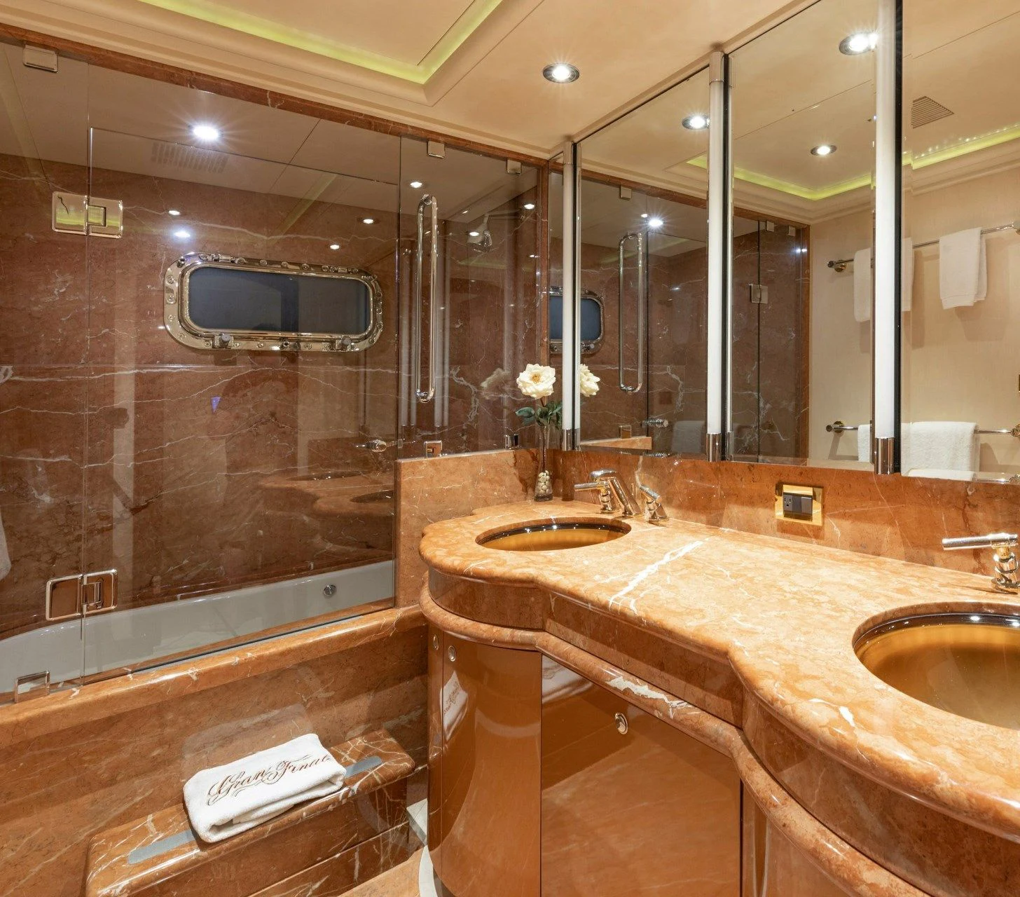 a bathroom with a large mirror aboard DRIVEN Yacht for Sale