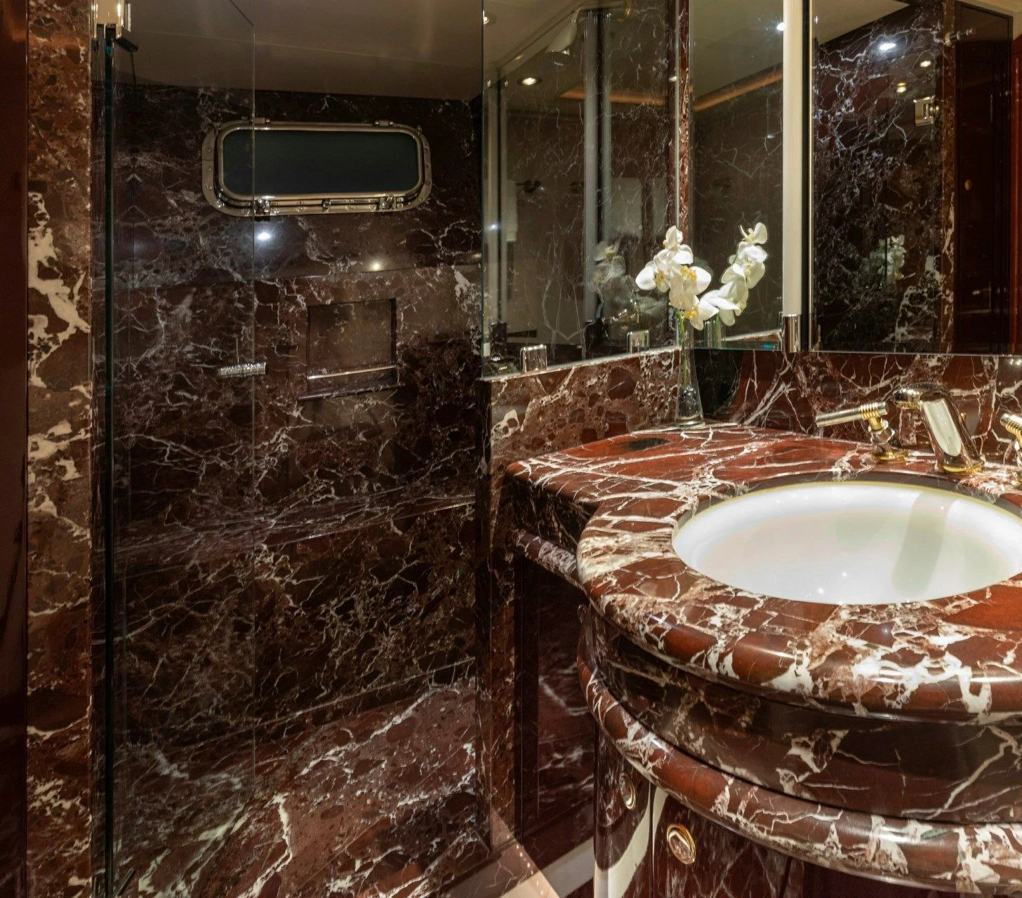 a bathroom with a marble counter top aboard DRIVEN Yacht for Sale