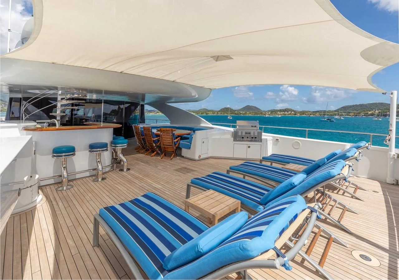 a deck with a view of the ocean and the ocean aboard DRIVEN Yacht for Sale
