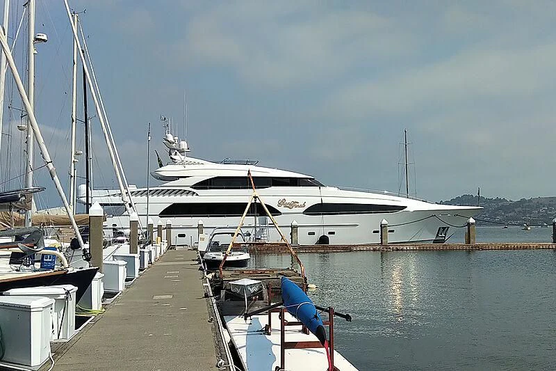 a boat docked at a pier aboard DRIVEN Yacht for Sale