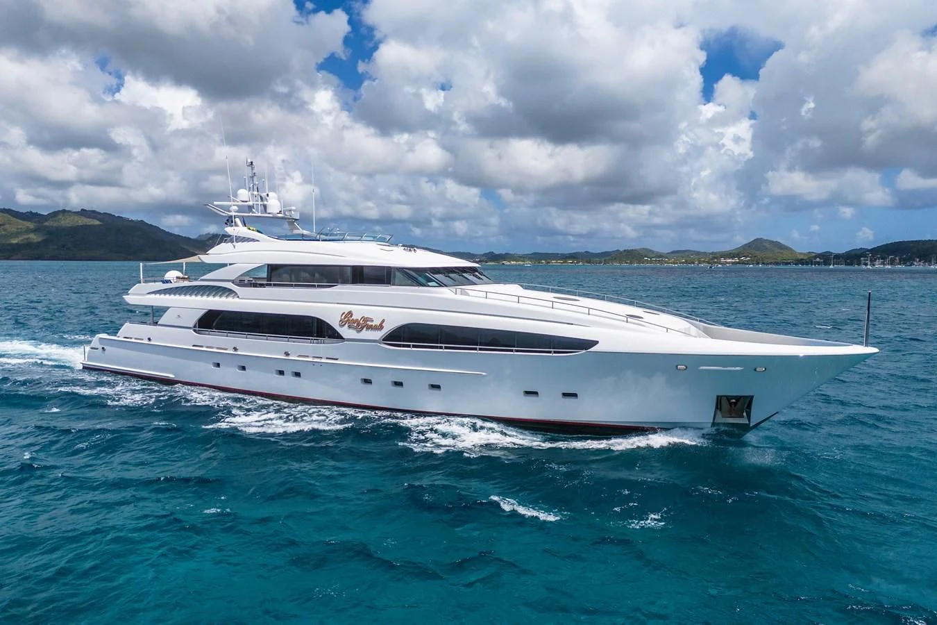 a white yacht in the water aboard DRIVEN Yacht for Sale