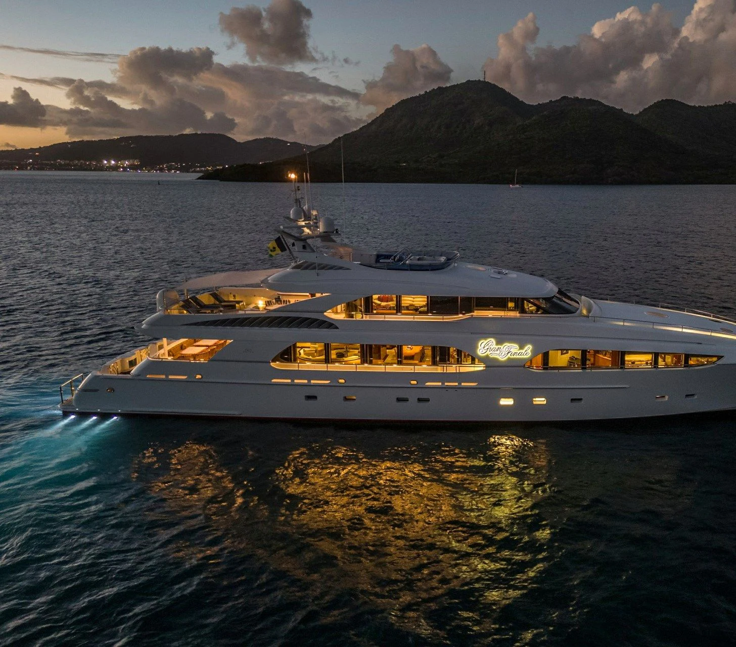 a white boat on water aboard DRIVEN Yacht for Sale