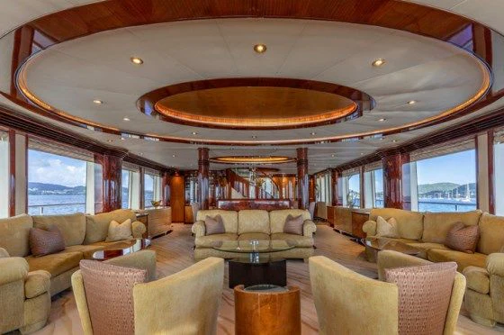 a living room with a large ceiling aboard DRIVEN Yacht for Sale