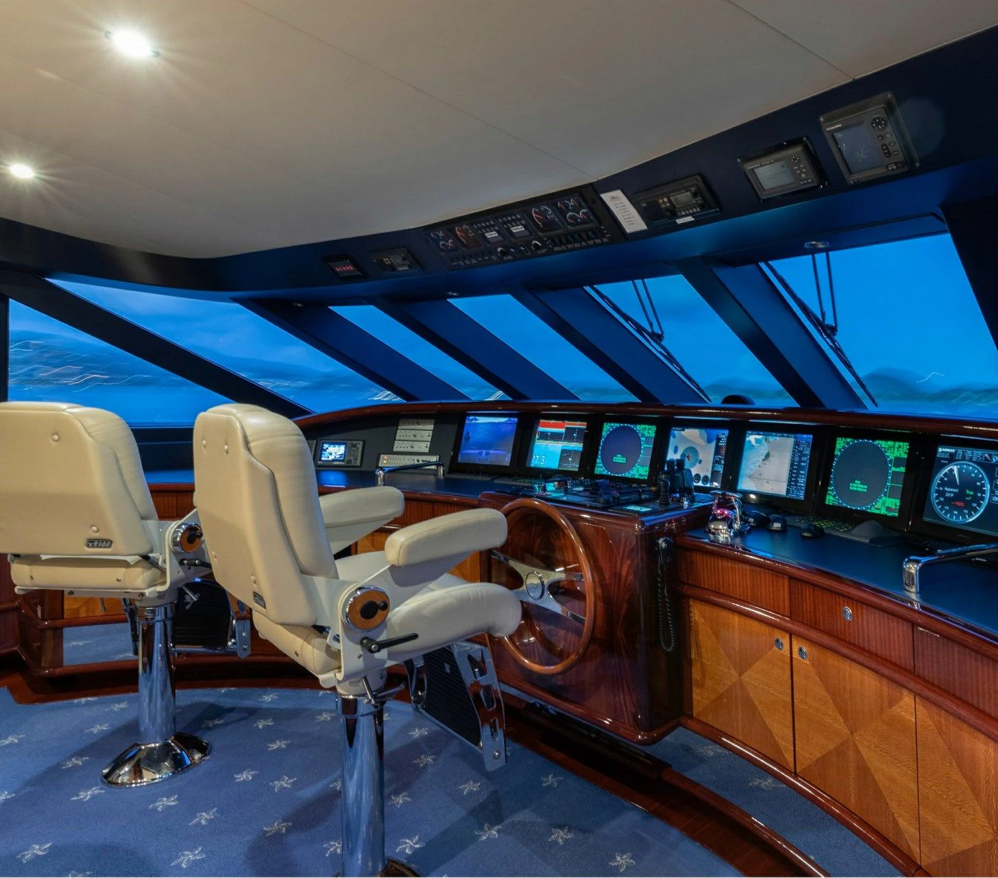 a room with a large screen aboard DRIVEN Yacht for Sale