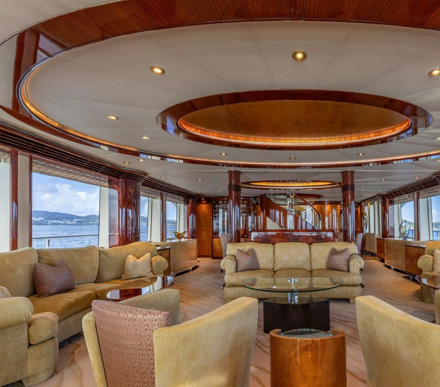 a living room with a large chandelier aboard DRIVEN Yacht for Sale
