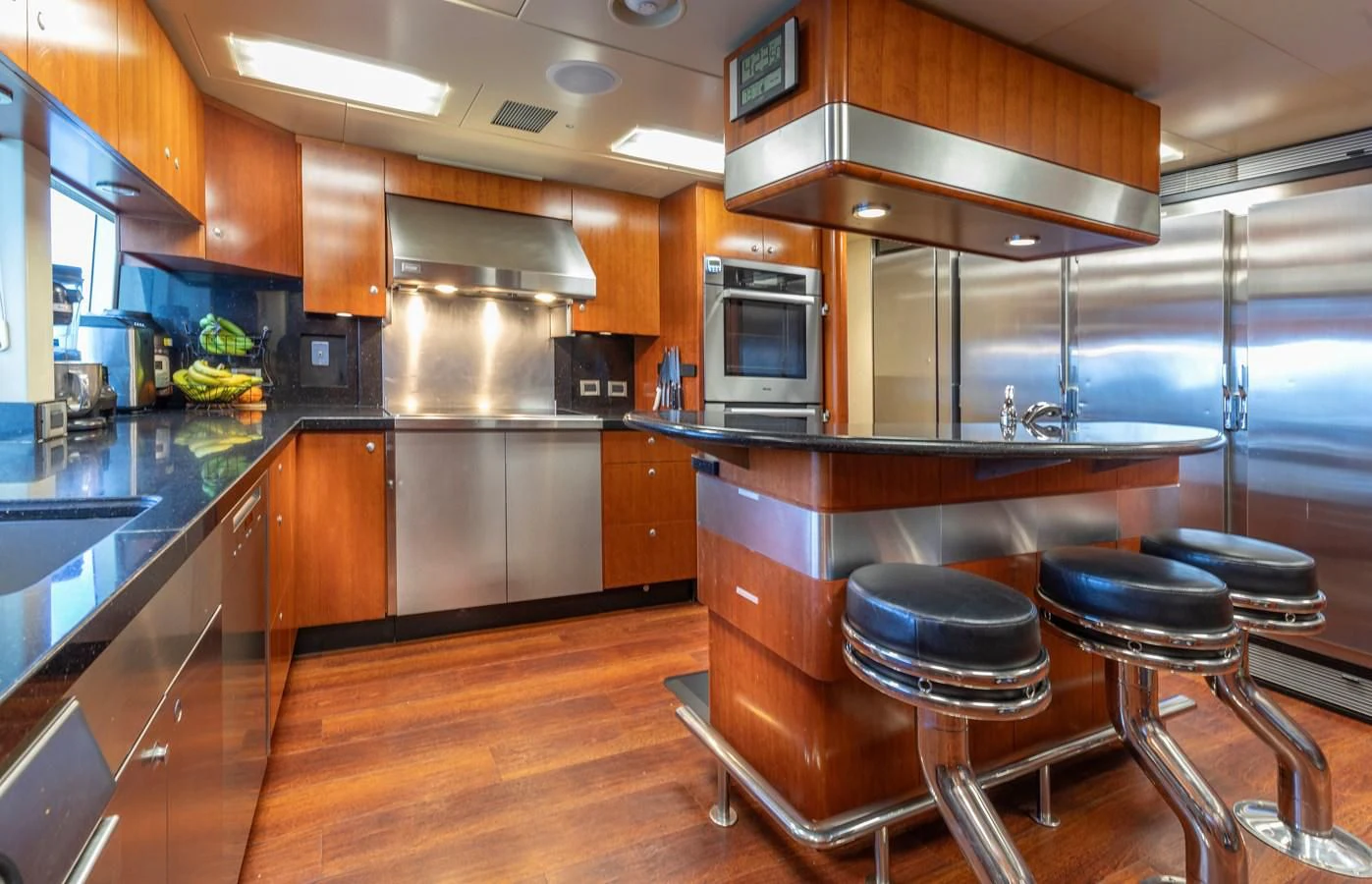 a kitchen with a large island aboard DRIVEN Yacht for Sale