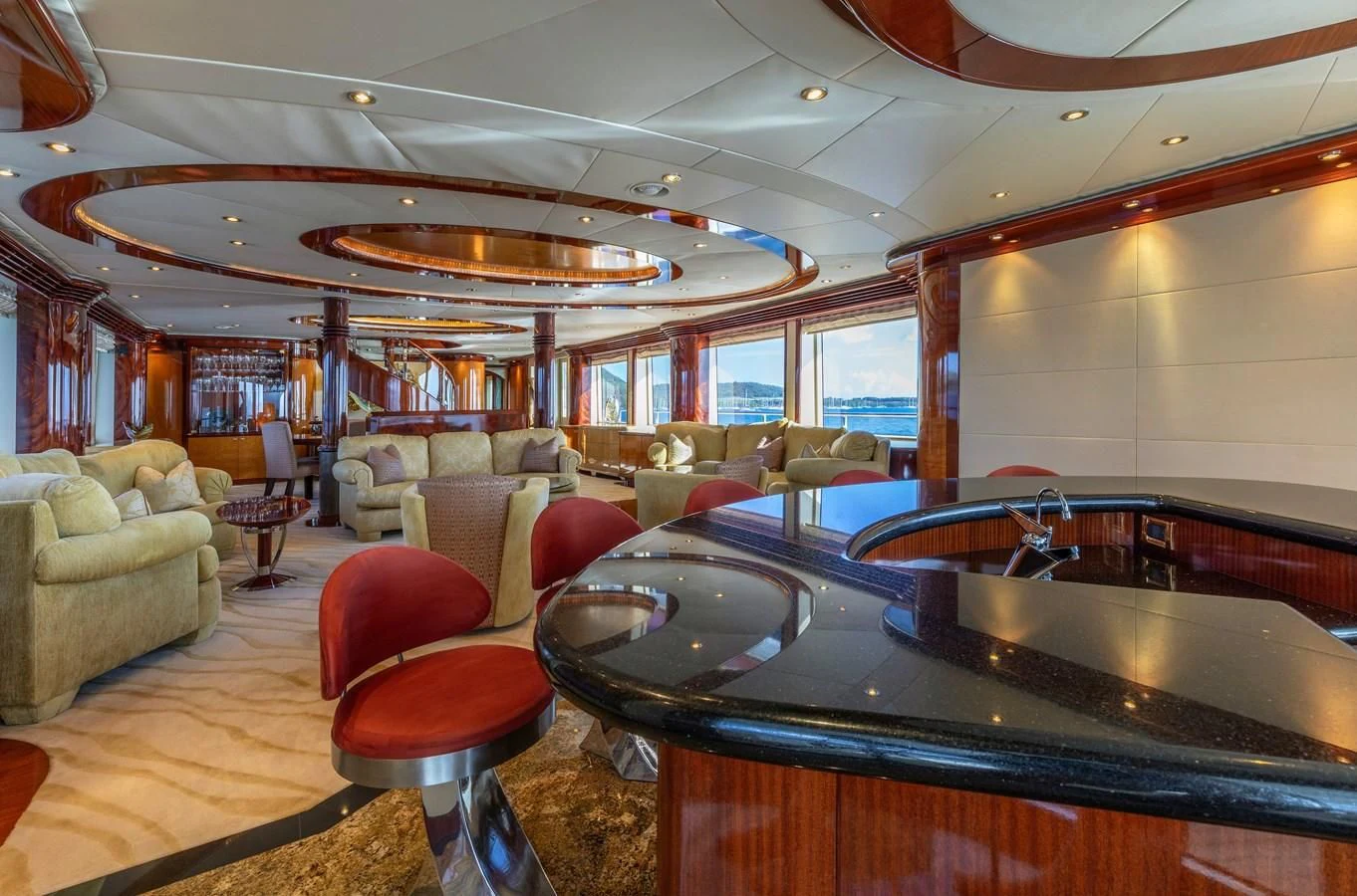 a large kitchen with a bar and bar aboard DRIVEN Yacht for Sale