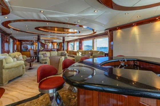 a large kitchen with a bar and bar aboard DRIVEN Yacht for Sale