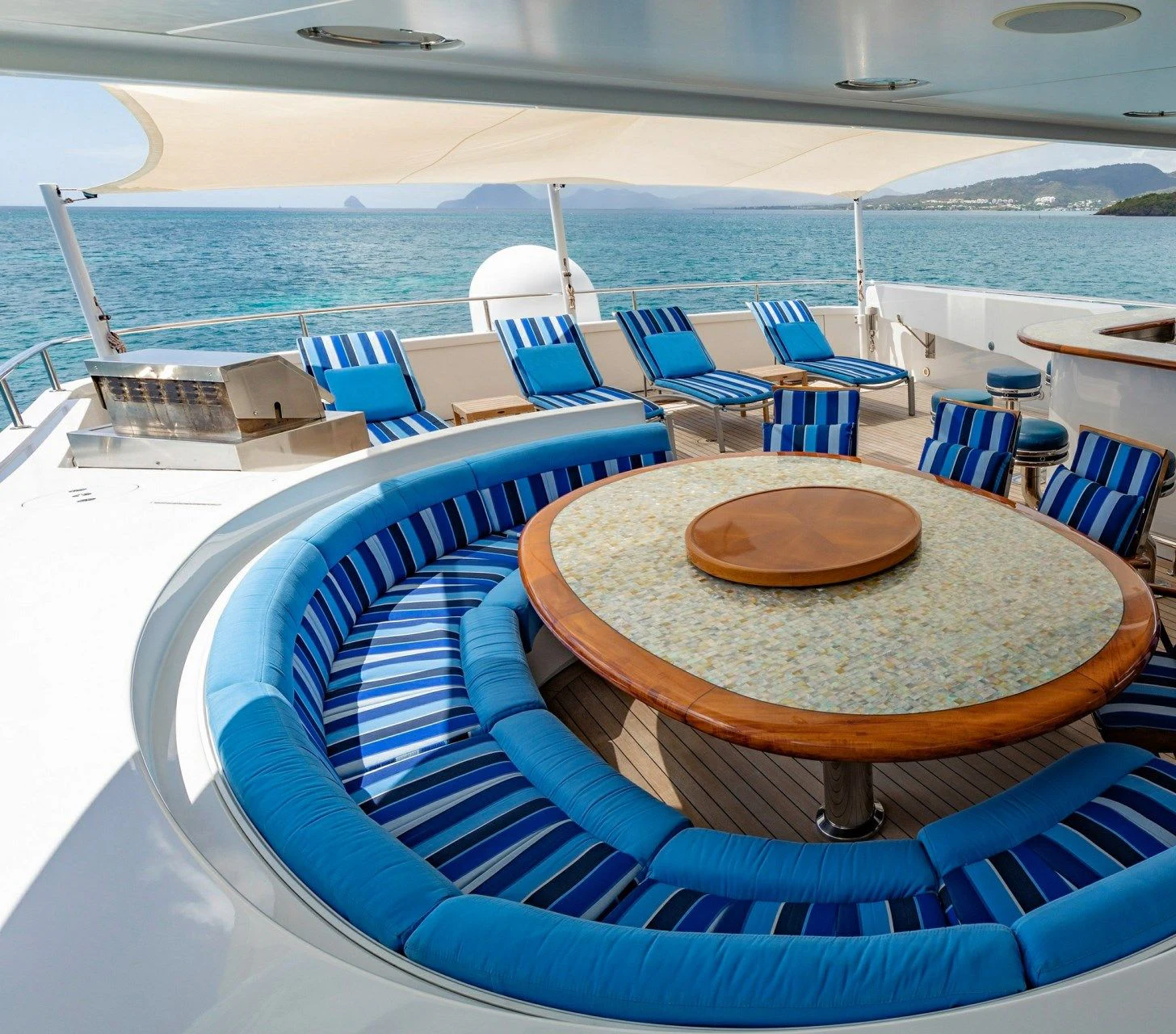a pool with chairs and tables aboard DRIVEN Yacht for Sale