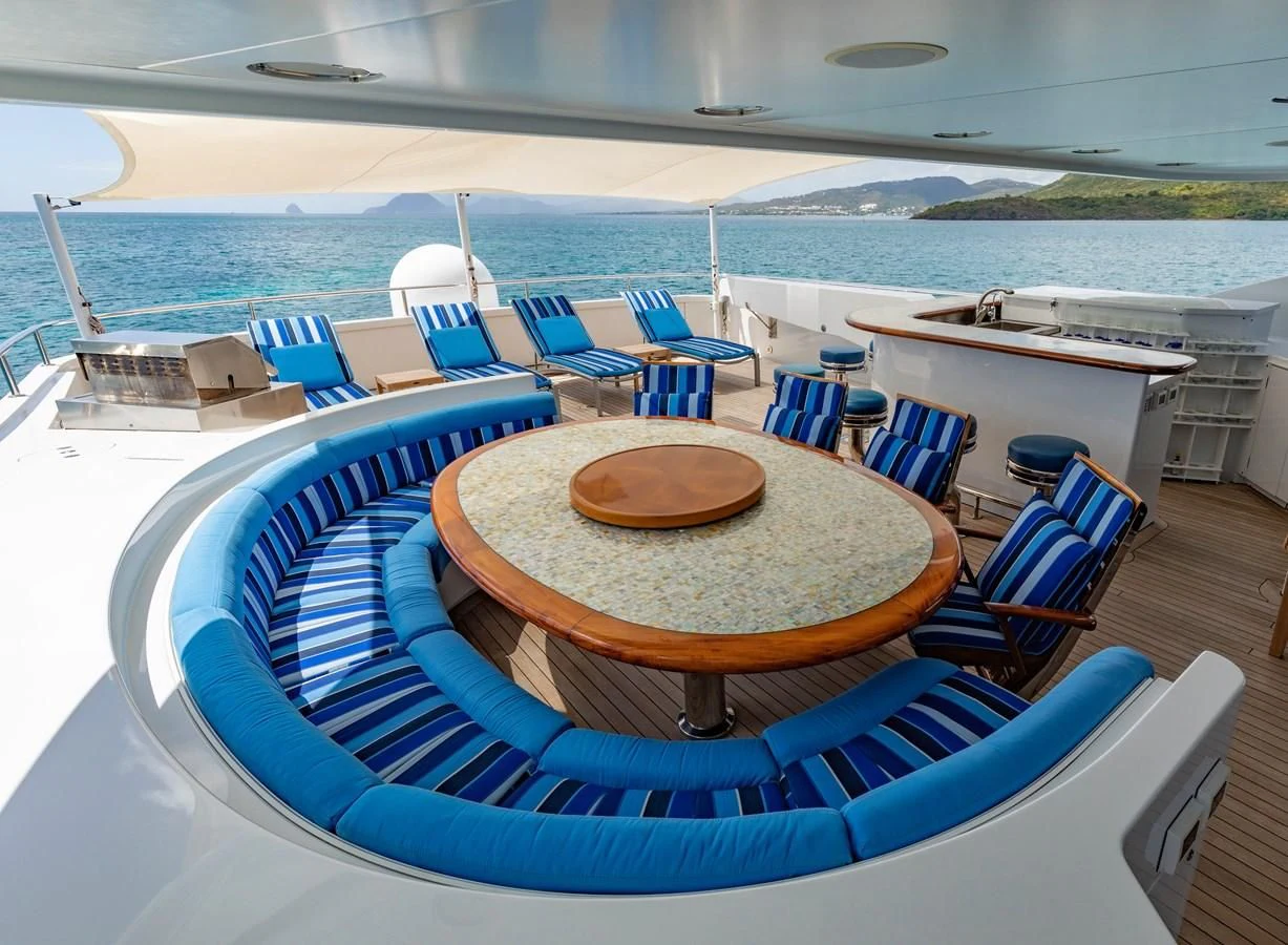 a pool with chairs and tables aboard DRIVEN Yacht for Sale