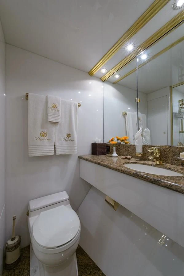 a bathroom with a sink and toilet aboard BIG WAVE Yacht for Sale