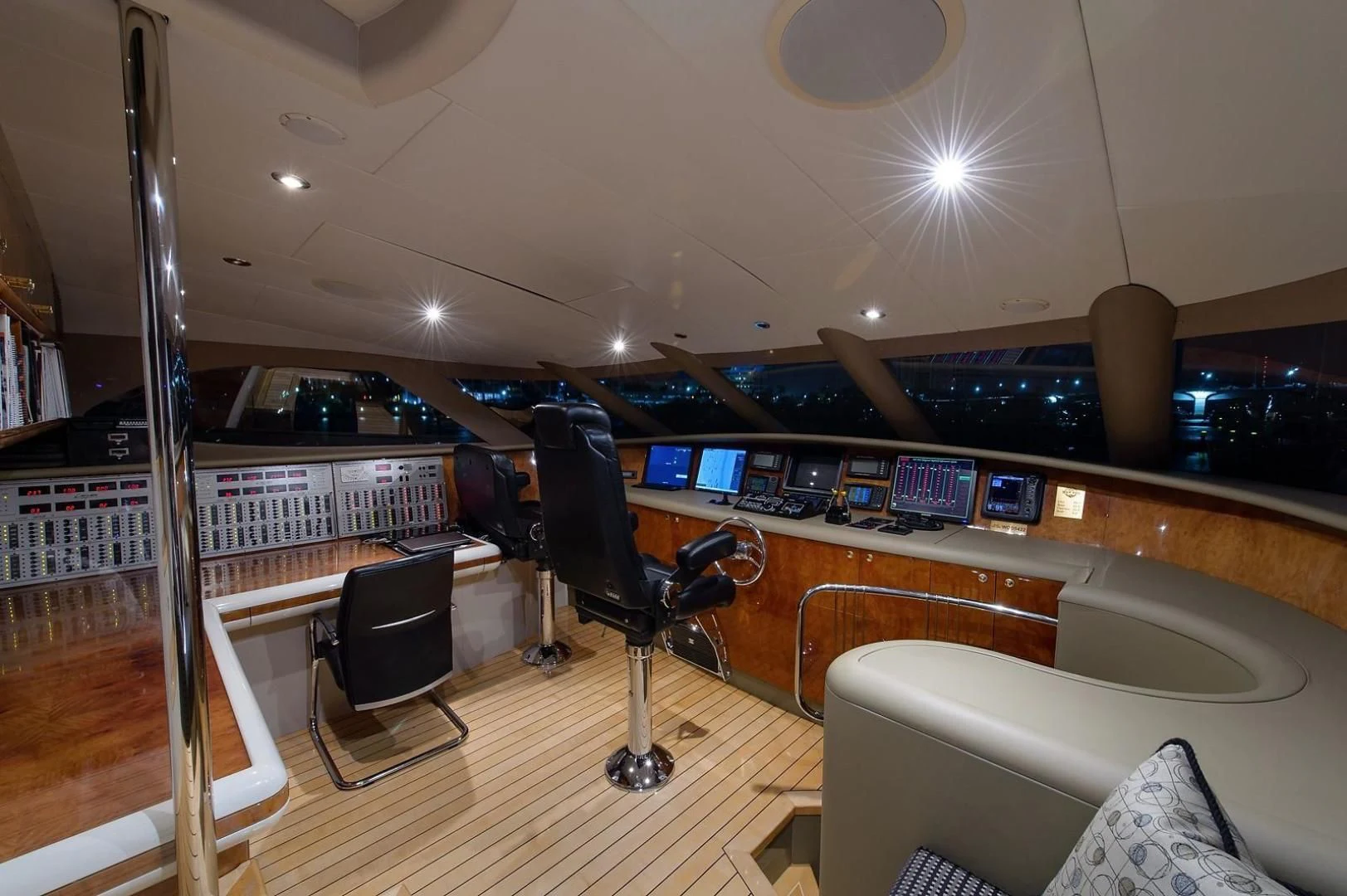 a room with a couch and a chair and a piano aboard BIG WAVE Yacht for Sale