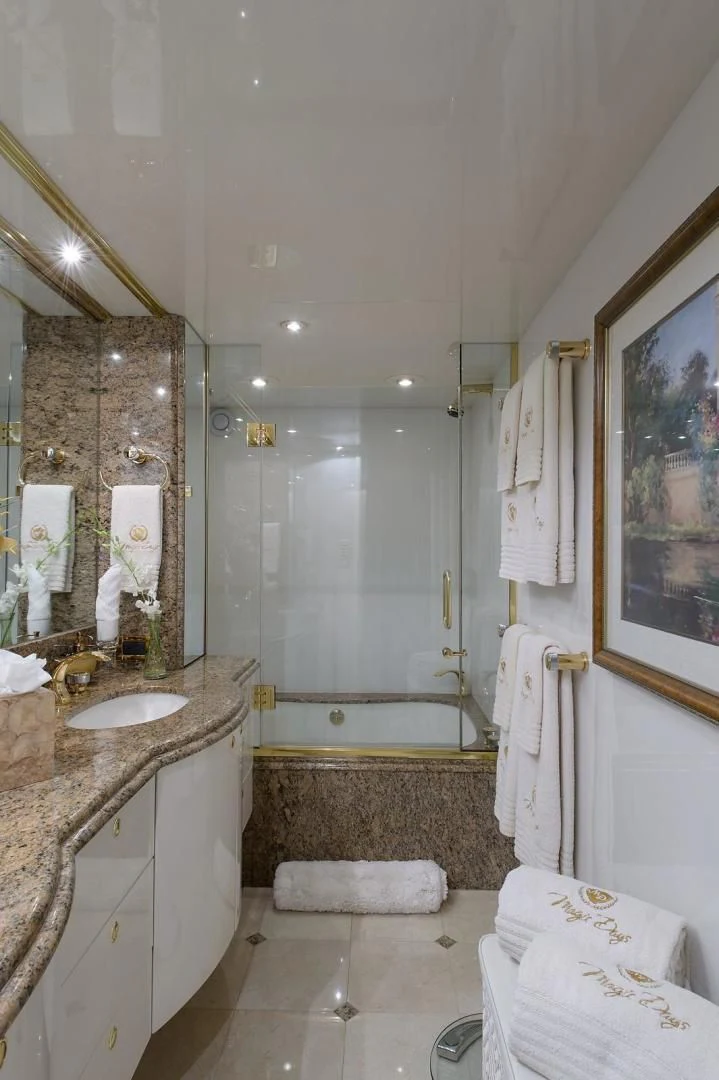a bathroom with a sink and a bathtub aboard BIG WAVE Yacht for Sale