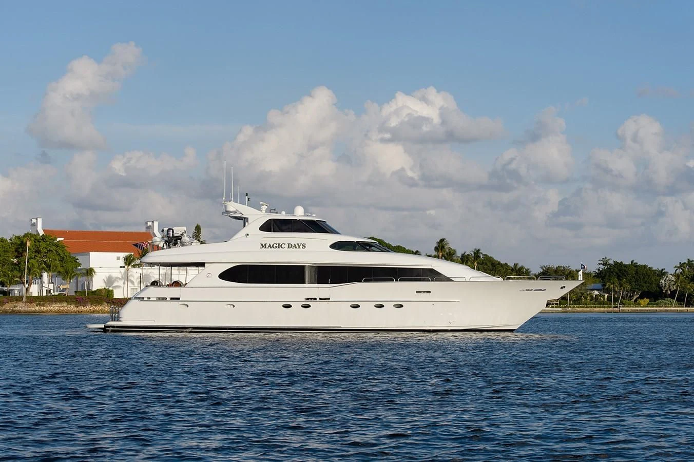 a white yacht on the water aboard BIG WAVE Yacht for Sale
