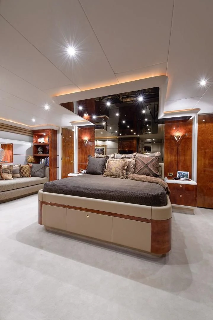 a large living room with a large mirror aboard BIG WAVE Yacht for Sale