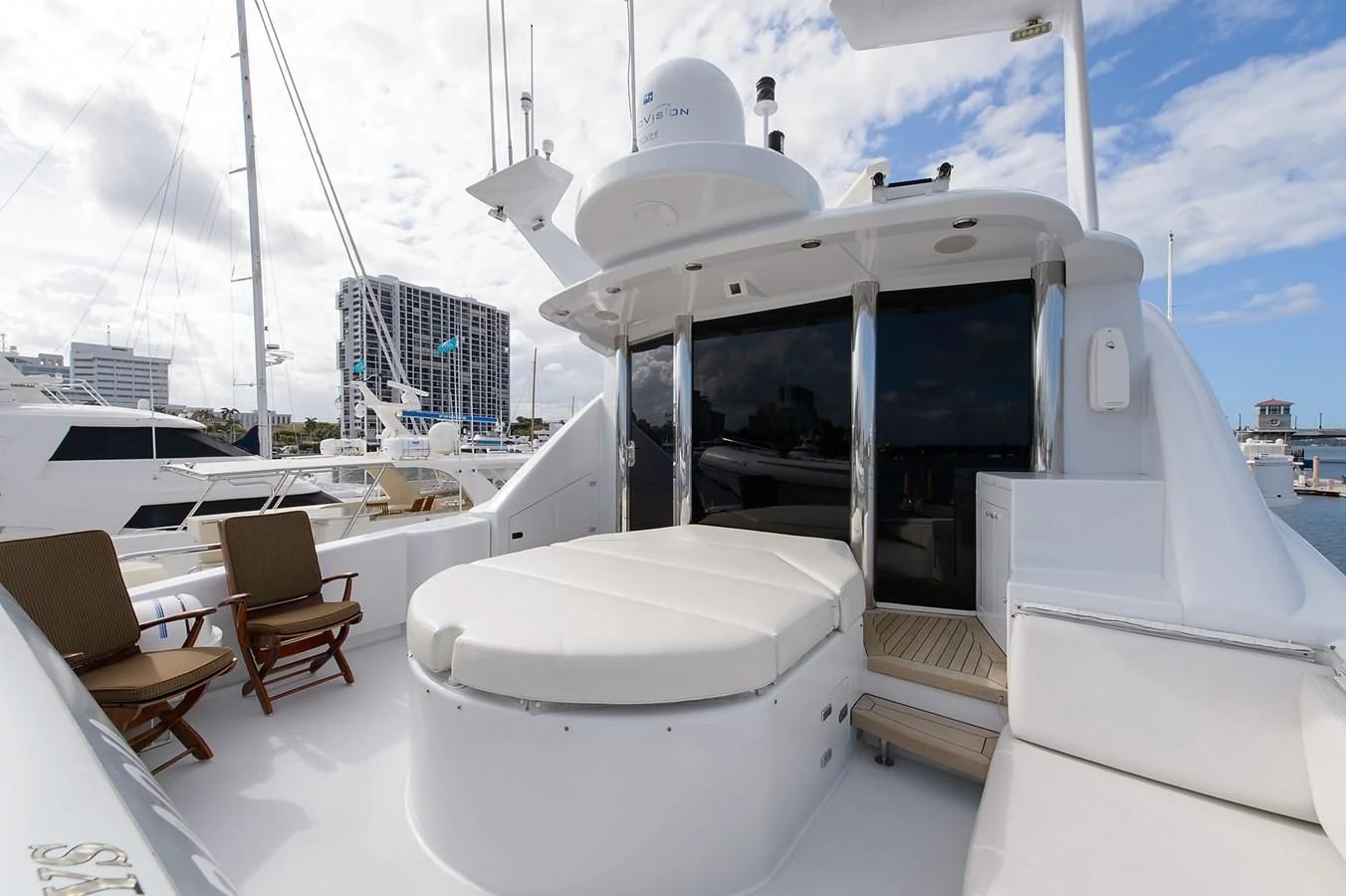 a boat with a white cover aboard BIG WAVE Yacht for Sale