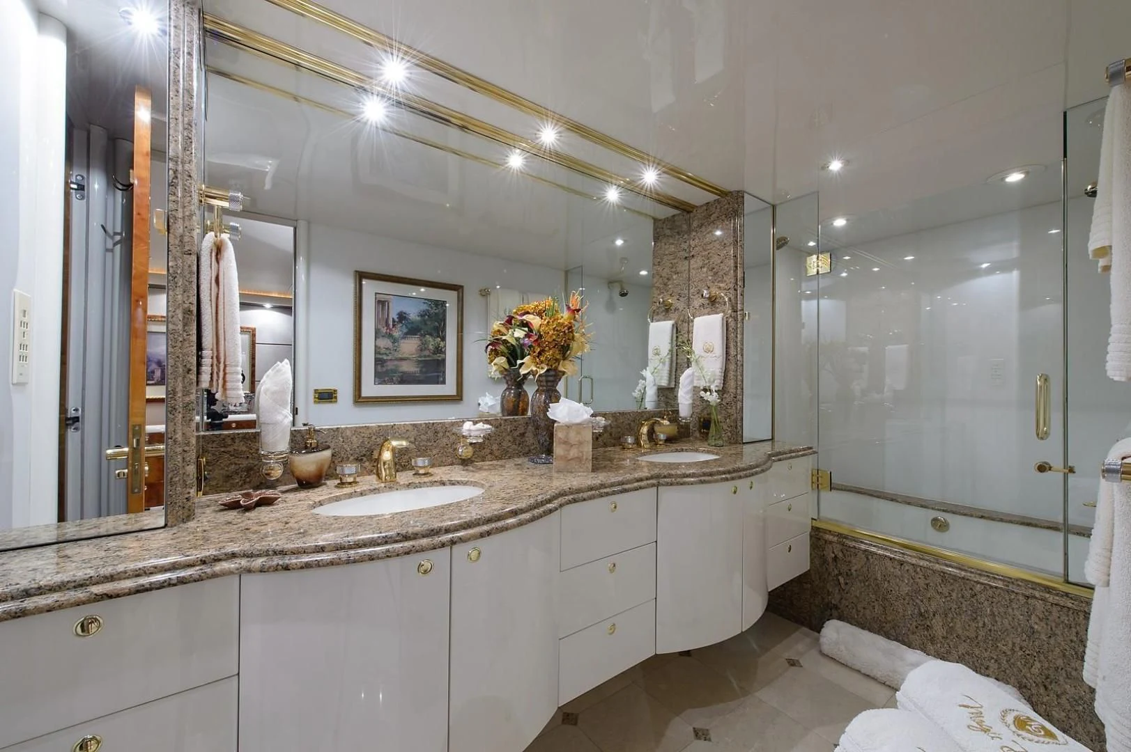 a bathroom with a large mirror aboard BIG WAVE Yacht for Sale