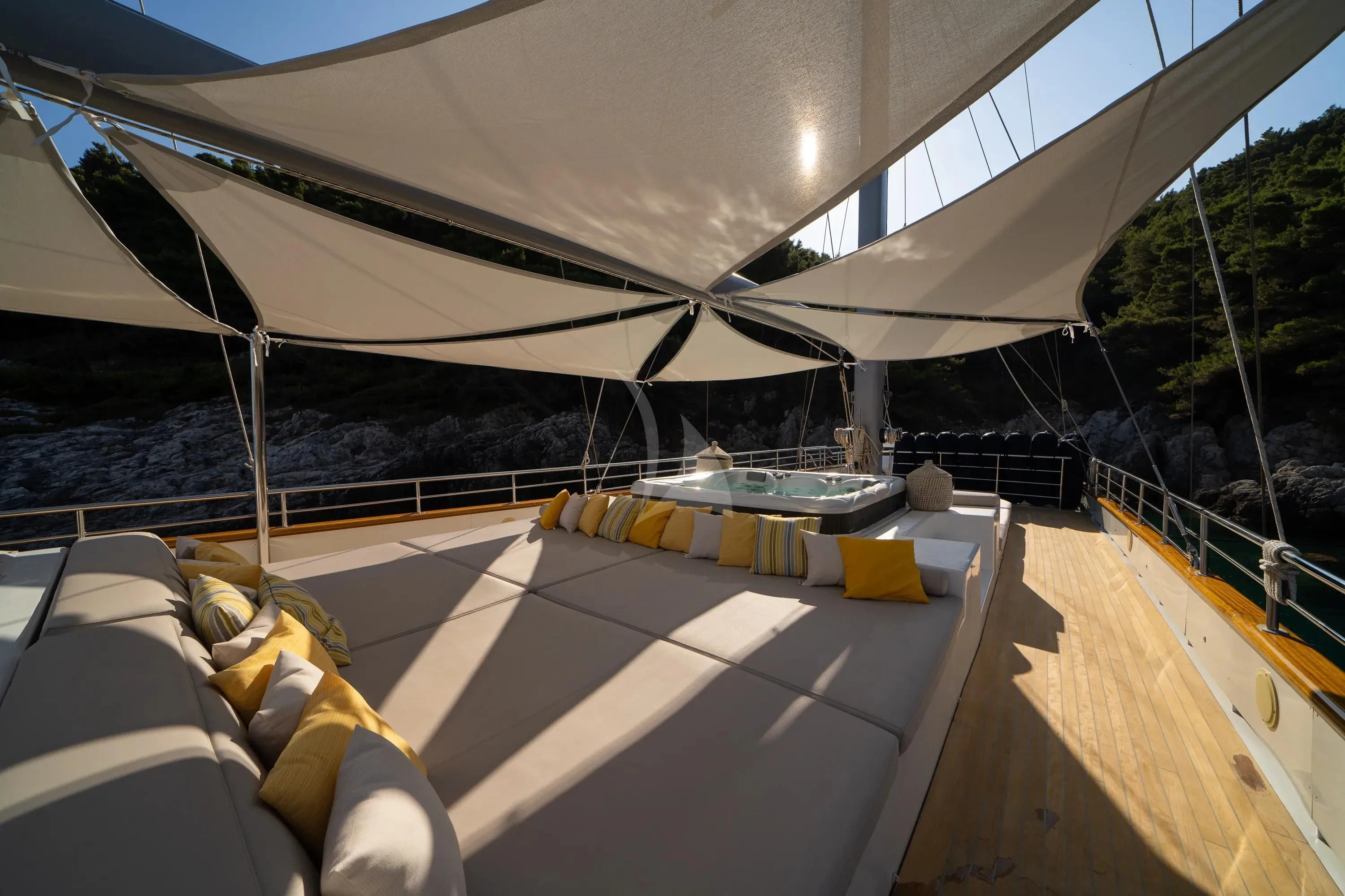 a tent with a deck and a pool aboard DALMATINO Yacht for Sale