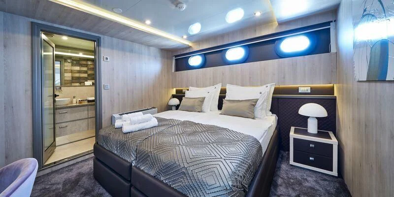 a hotel room with a bed aboard DALMATINO Yacht for Sale