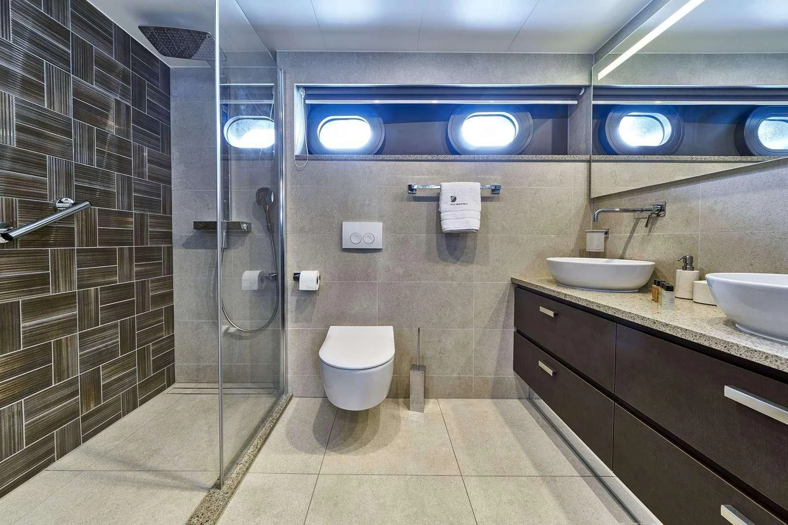a bathroom with a glass shower aboard DALMATINO Yacht for Sale