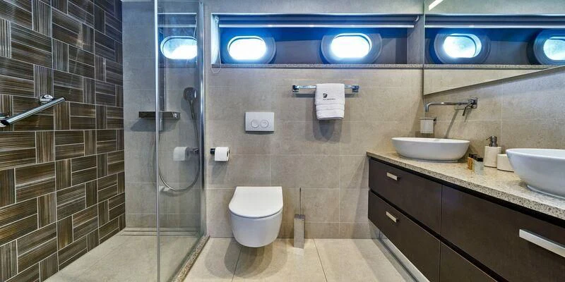 a bathroom with a glass shower aboard DALMATINO Yacht for Sale