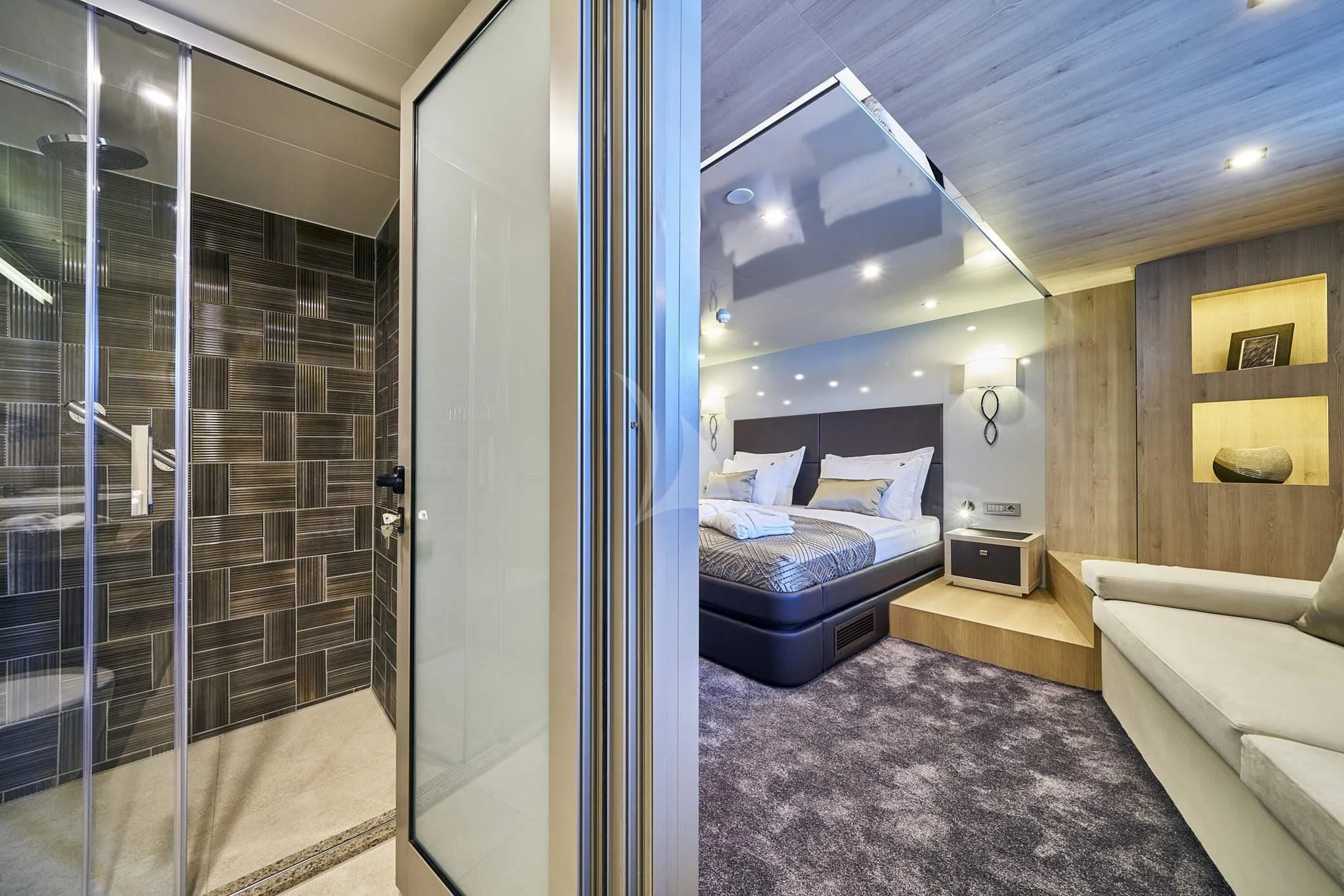 a room with a bed and a glass door aboard DALMATINO Yacht for Sale