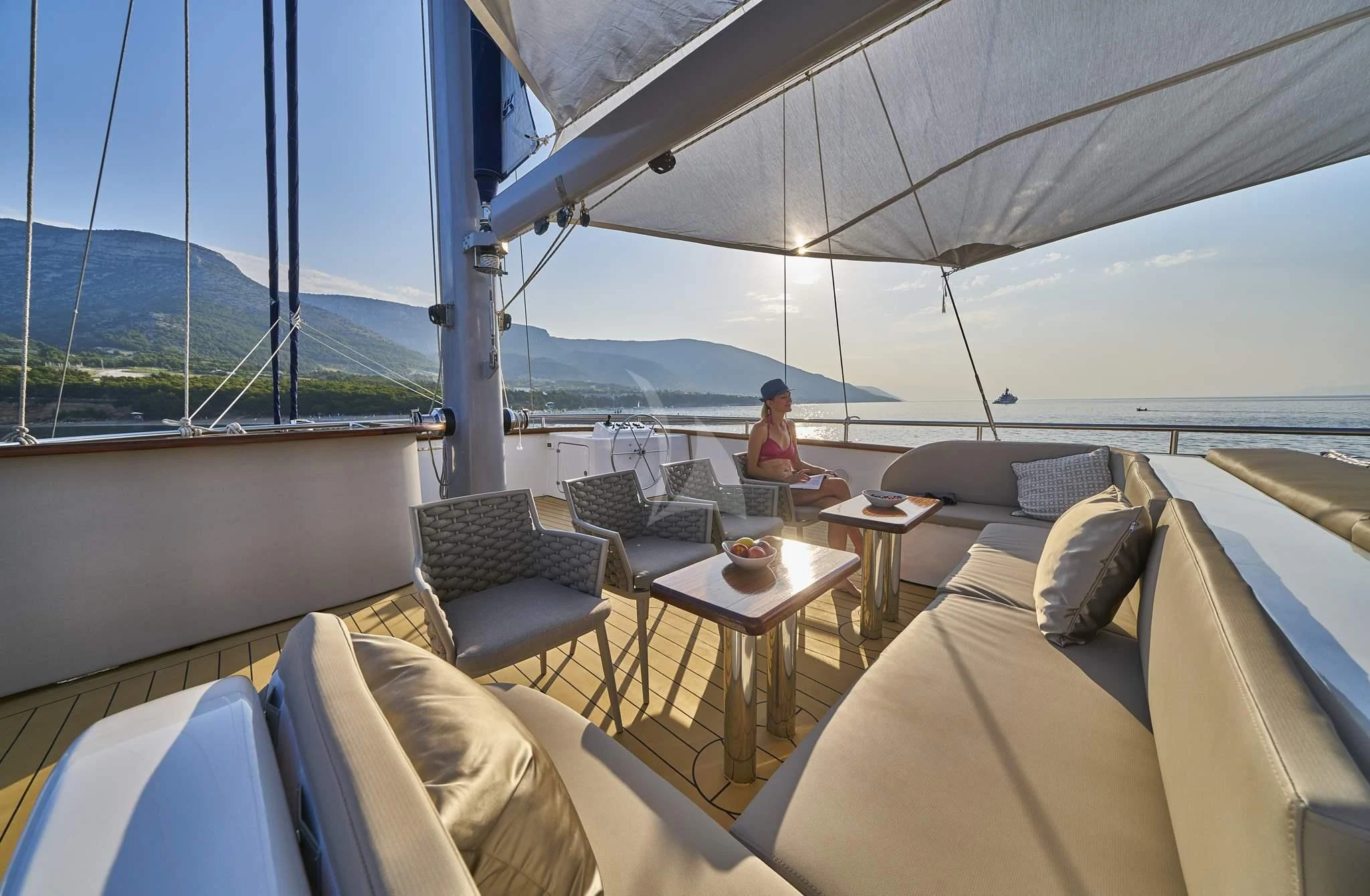 a person sitting on a boat aboard DALMATINO Yacht for Sale