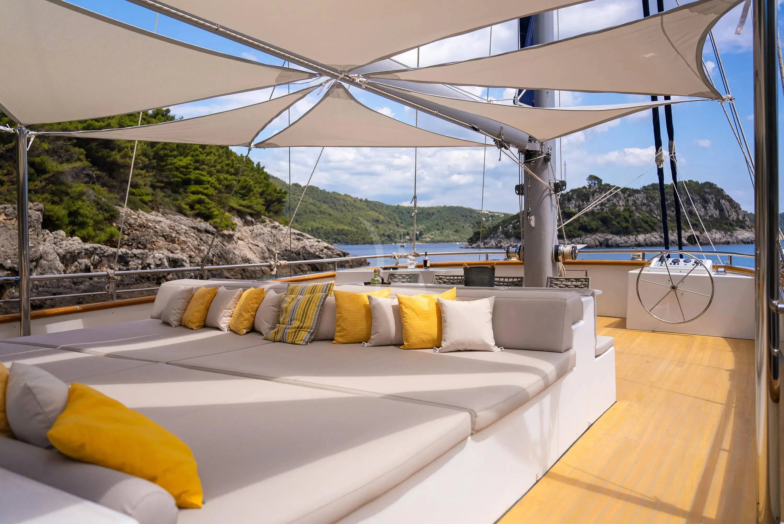 a bed on a deck aboard DALMATINO Yacht for Sale