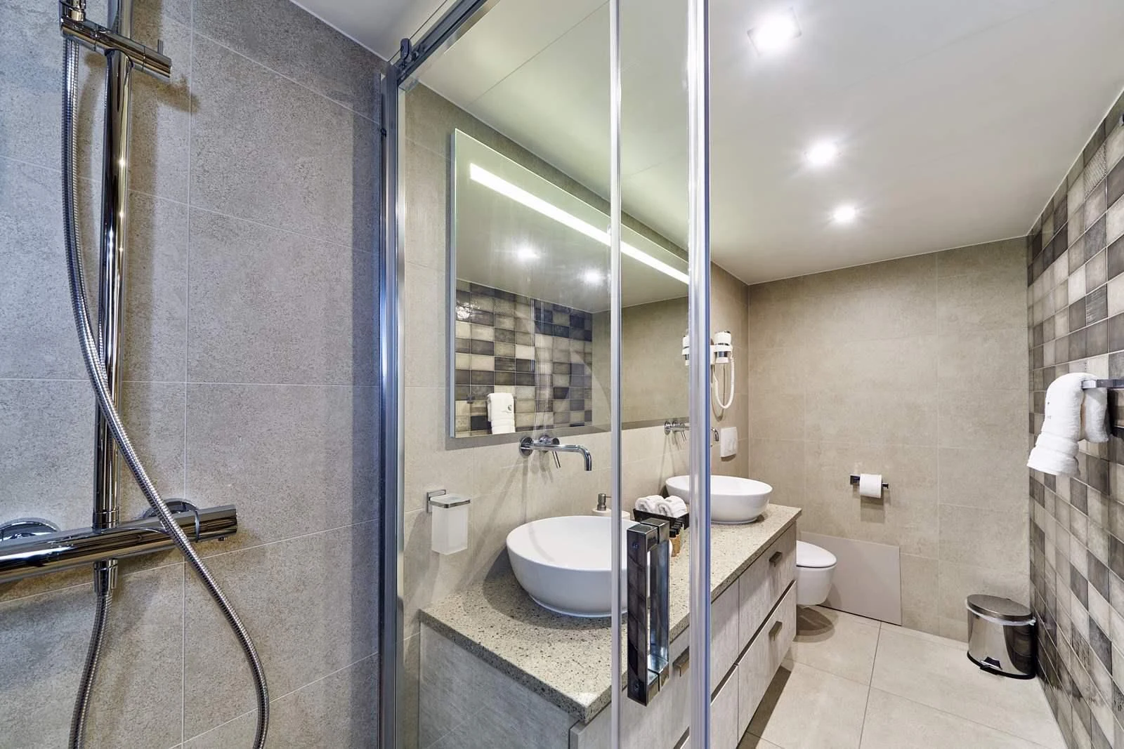 a bathroom with a glass shower aboard DALMATINO Yacht for Sale