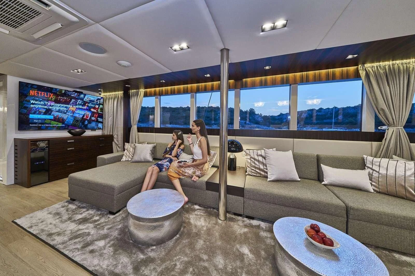 a person sitting on a couch aboard DALMATINO Yacht for Sale