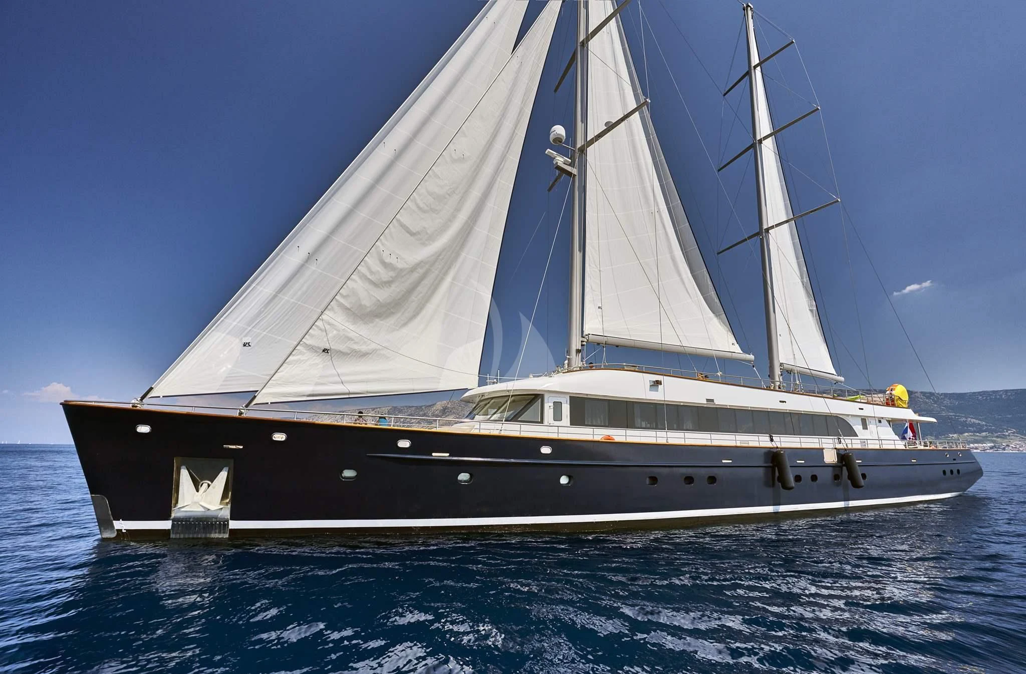 a white boat on the water aboard DALMATINO Yacht for Sale