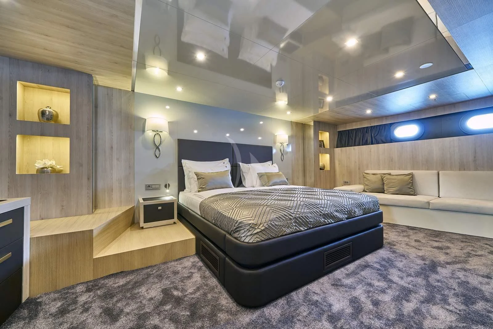 a bedroom with a bed and a couch aboard DALMATINO Yacht for Sale