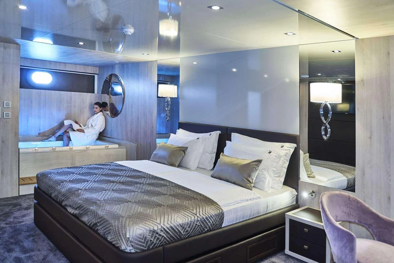a person jumping on a bed aboard DALMATINO Yacht for Sale