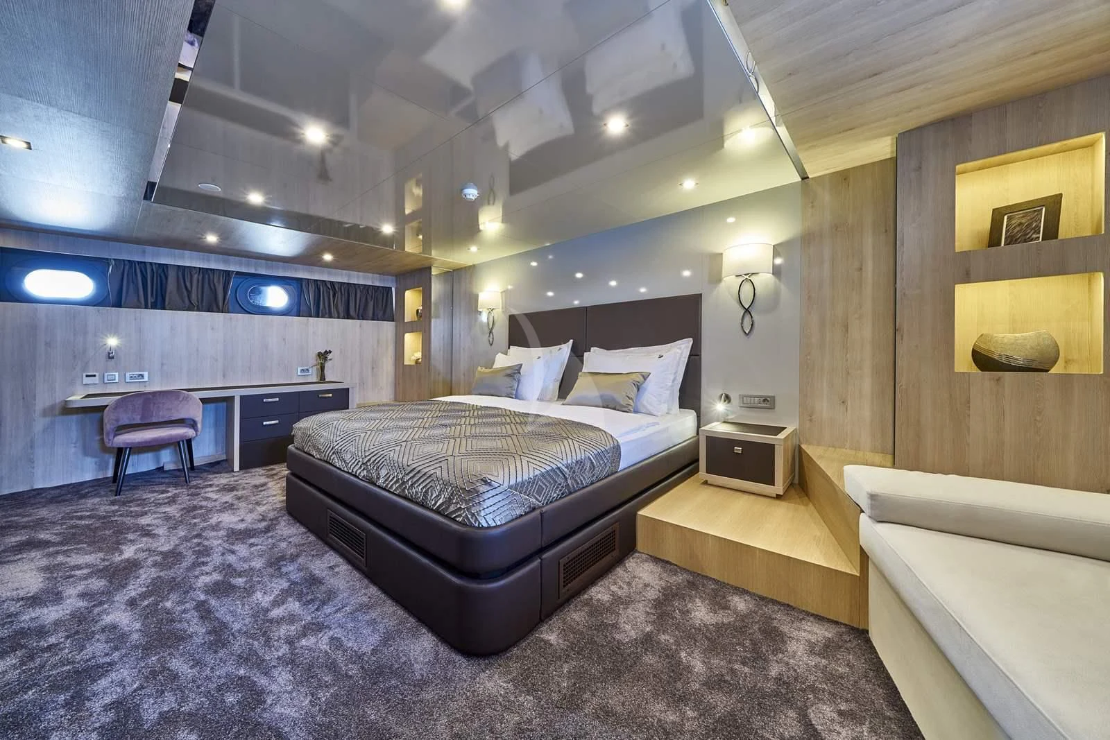a room with a bed and a desk aboard DALMATINO Yacht for Sale