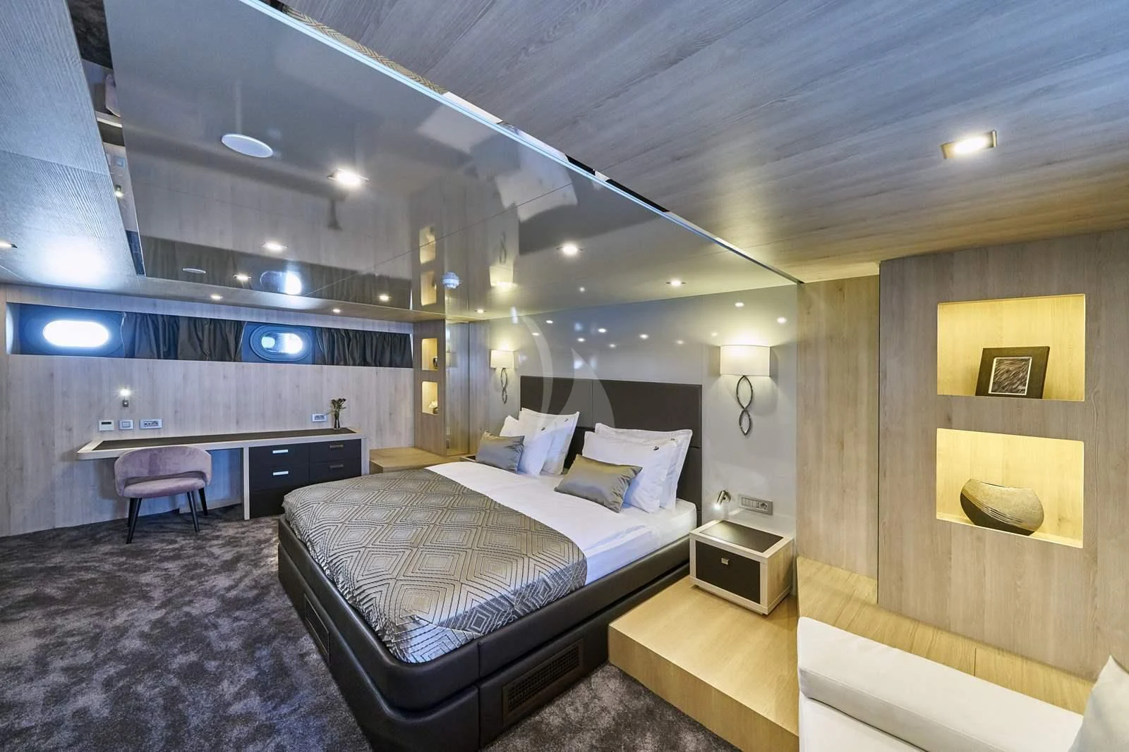 a room with a bed and a desk aboard DALMATINO Yacht for Sale