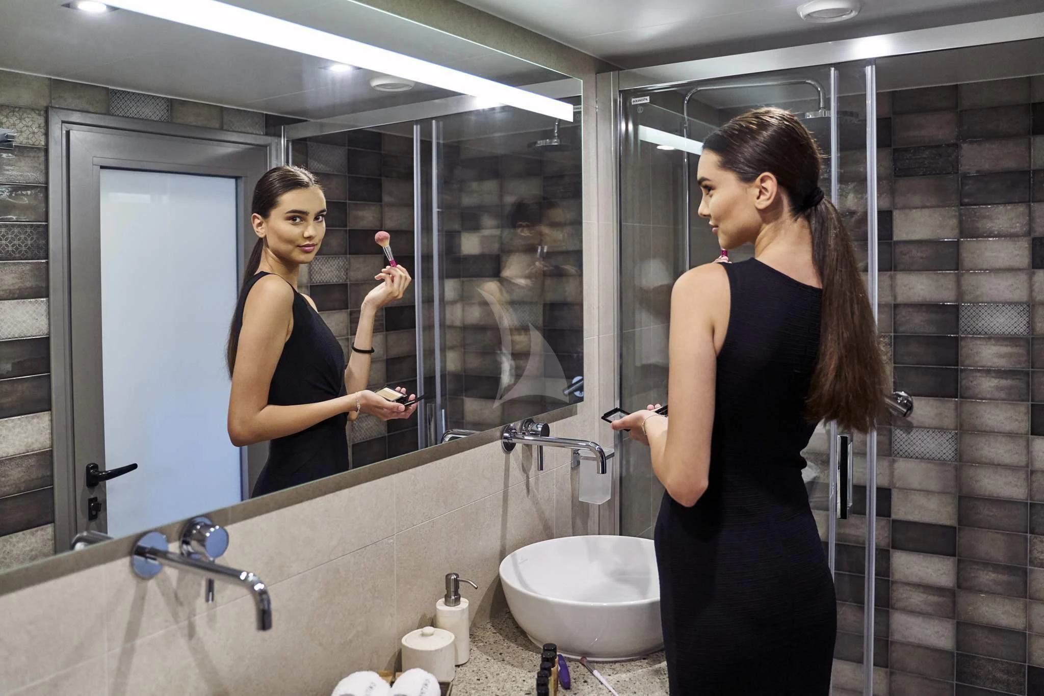 a woman in a bathroom aboard DALMATINO Yacht for Sale