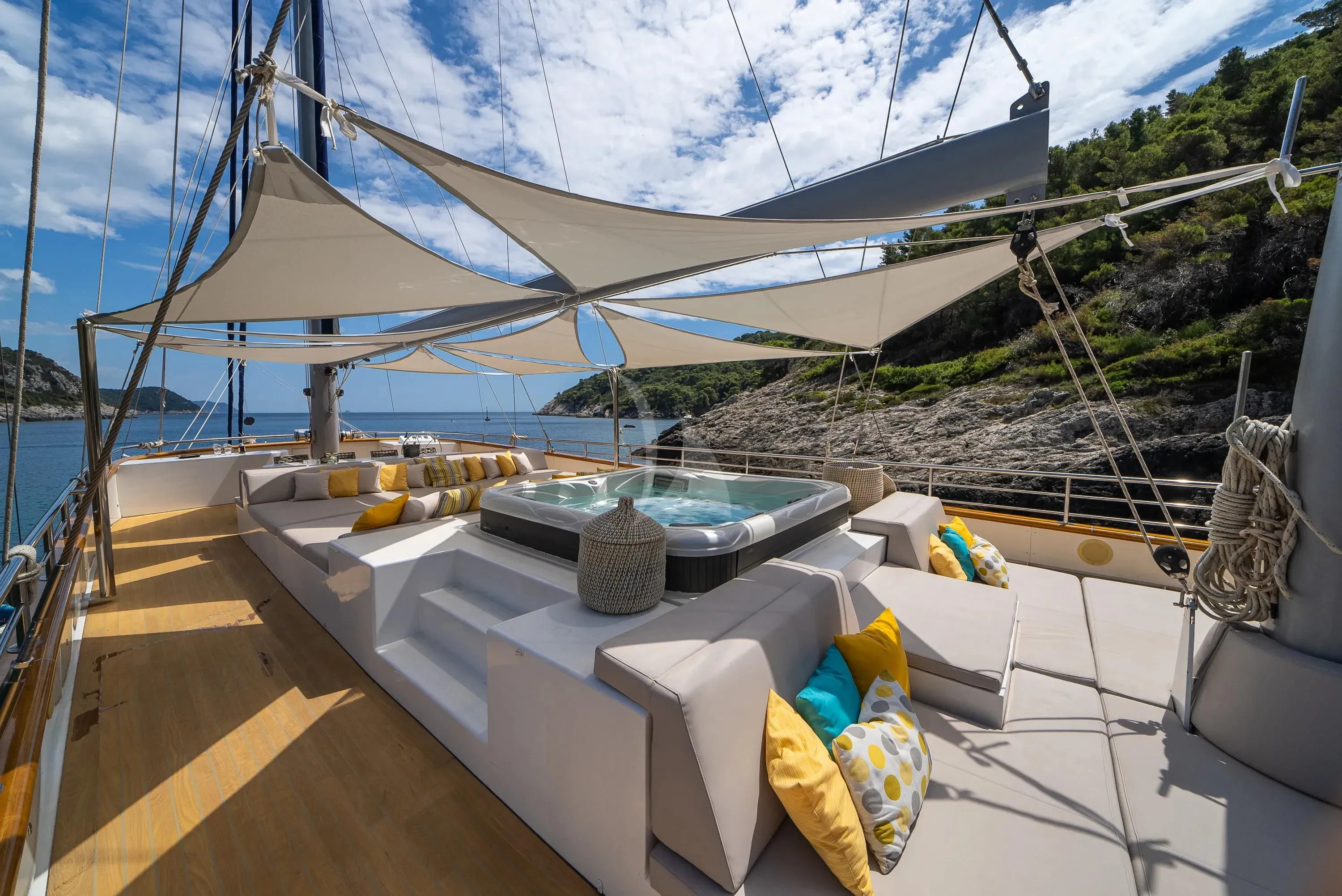 a tent with a table and chairs aboard DALMATINO Yacht for Sale