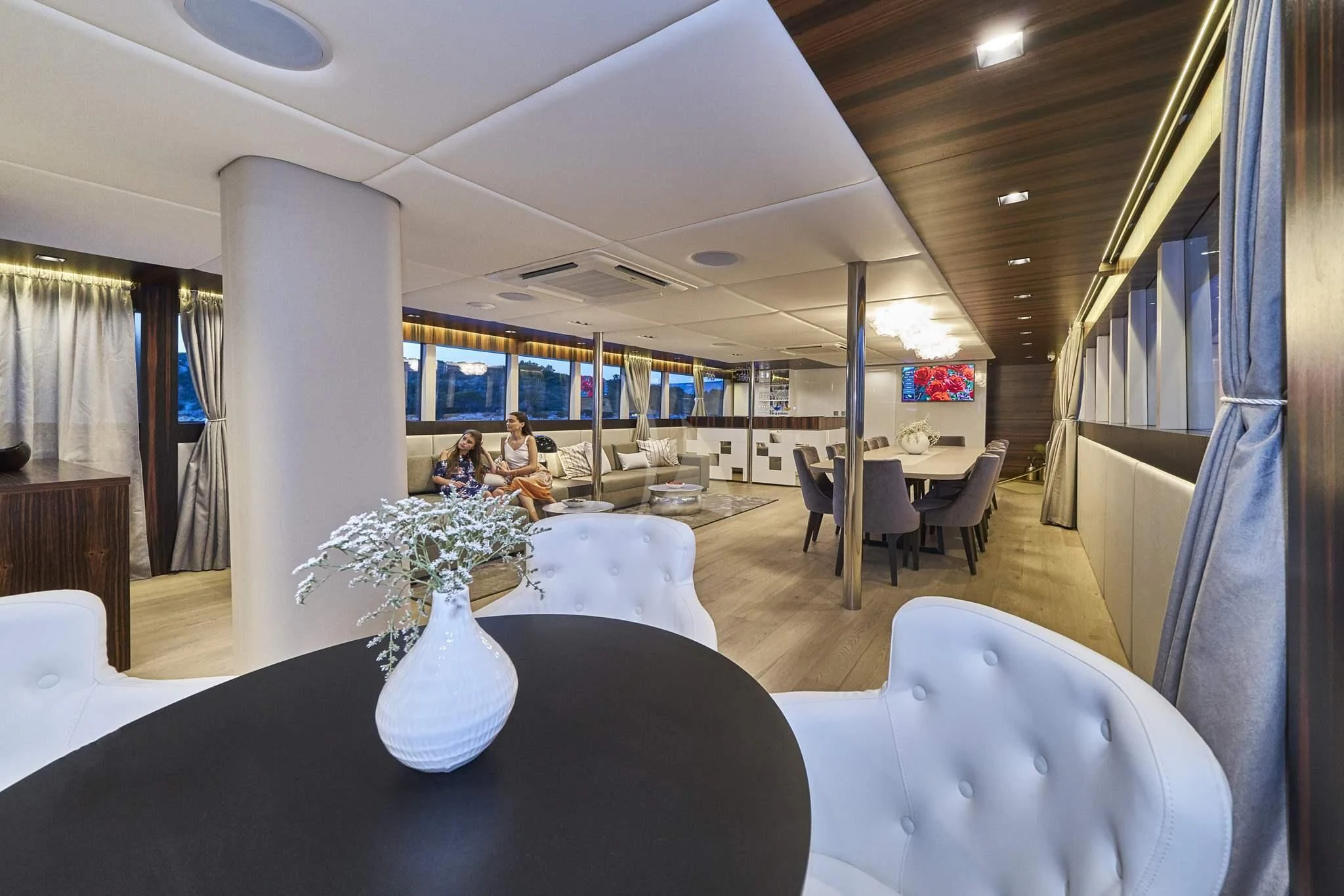 a vase of flowers on a table aboard DALMATINO Yacht for Sale