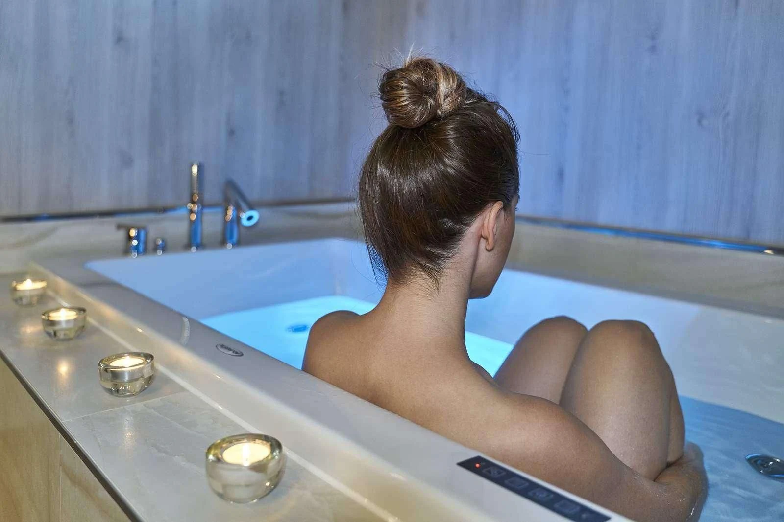 a woman sitting in a bathtub aboard DALMATINO Yacht for Sale