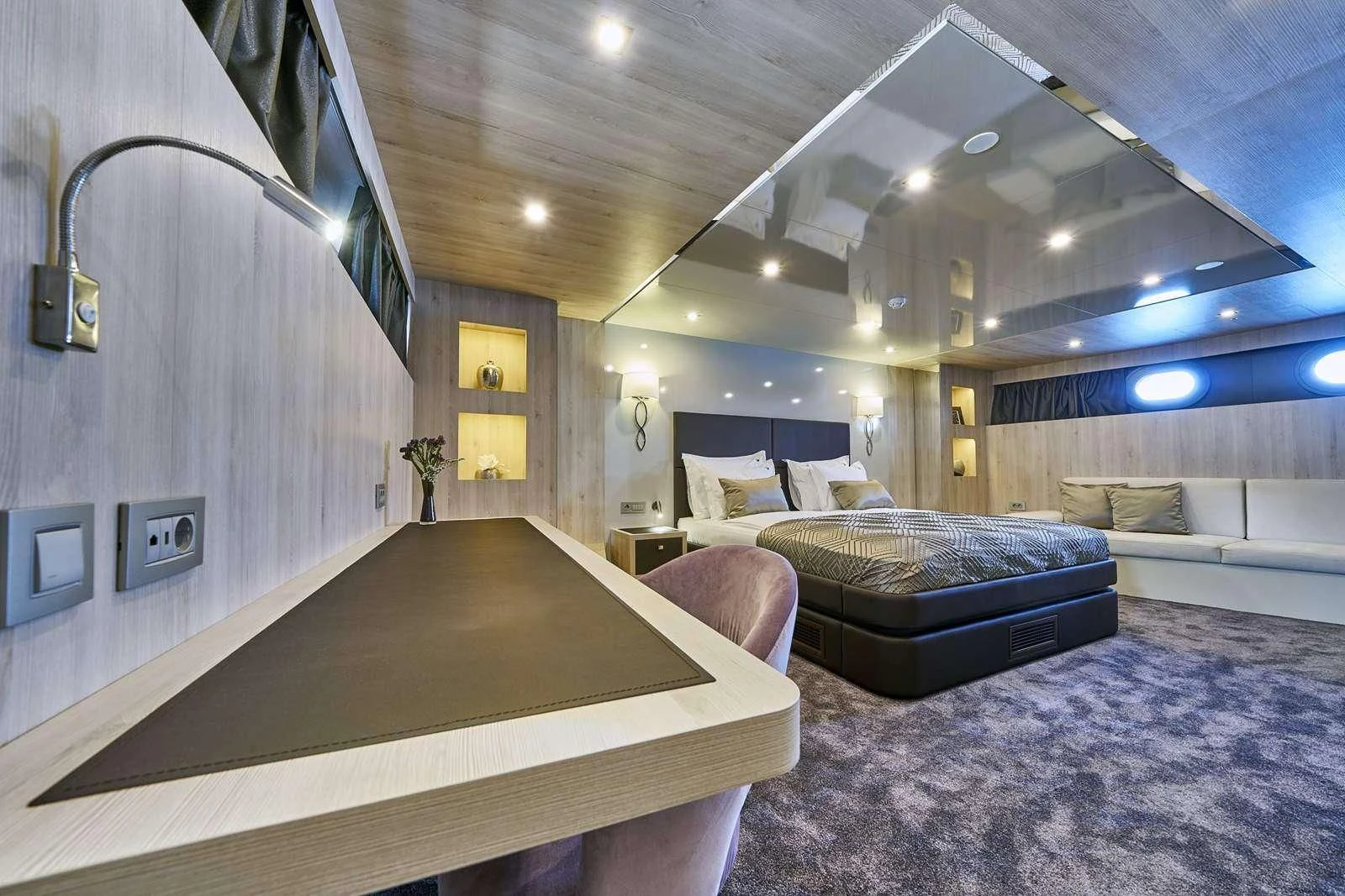 a room with a couch and a table aboard DALMATINO Yacht for Sale
