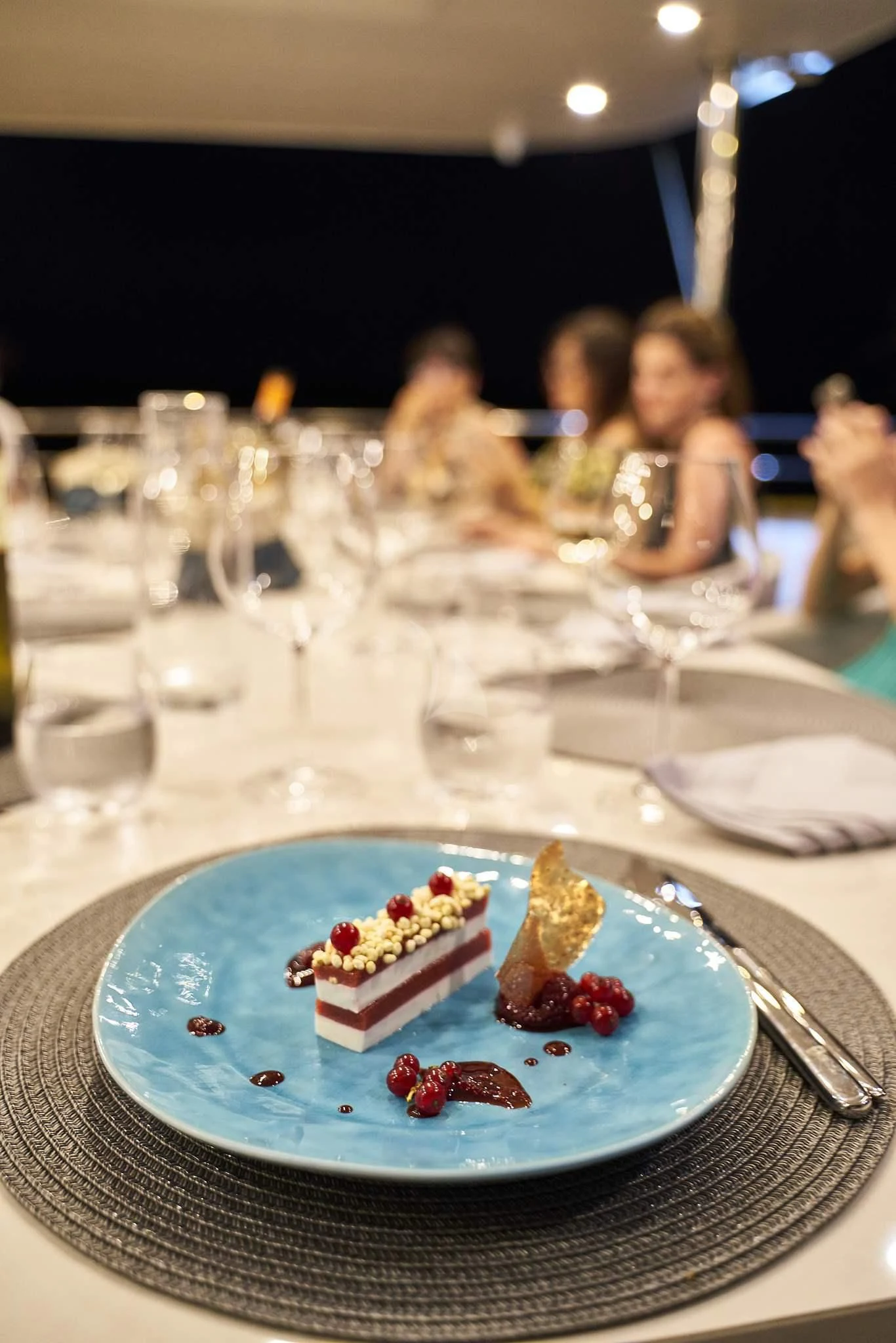 a cake on a plate aboard DALMATINO Yacht for Sale