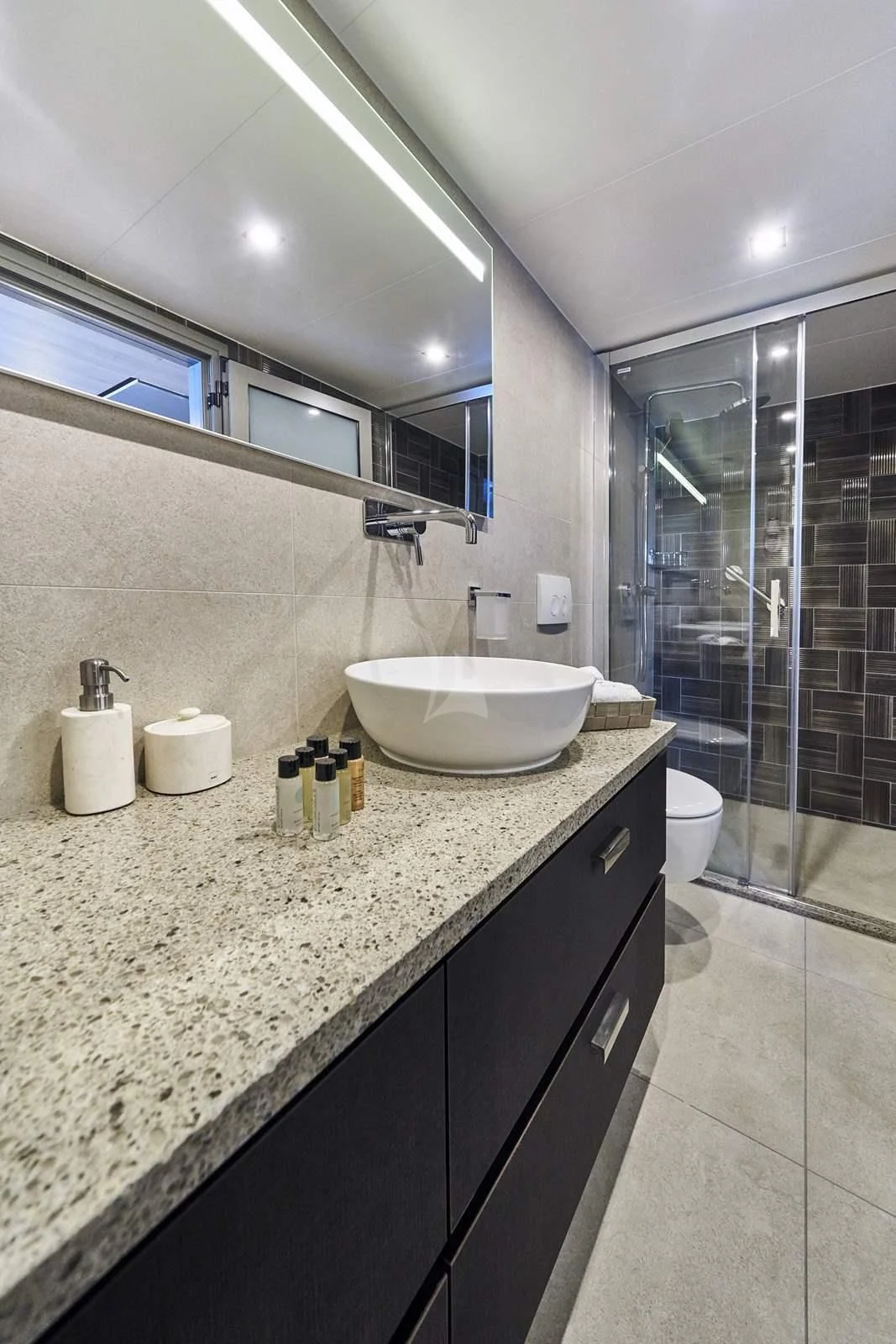a bathroom with a sink and a shower aboard DALMATINO Yacht for Sale