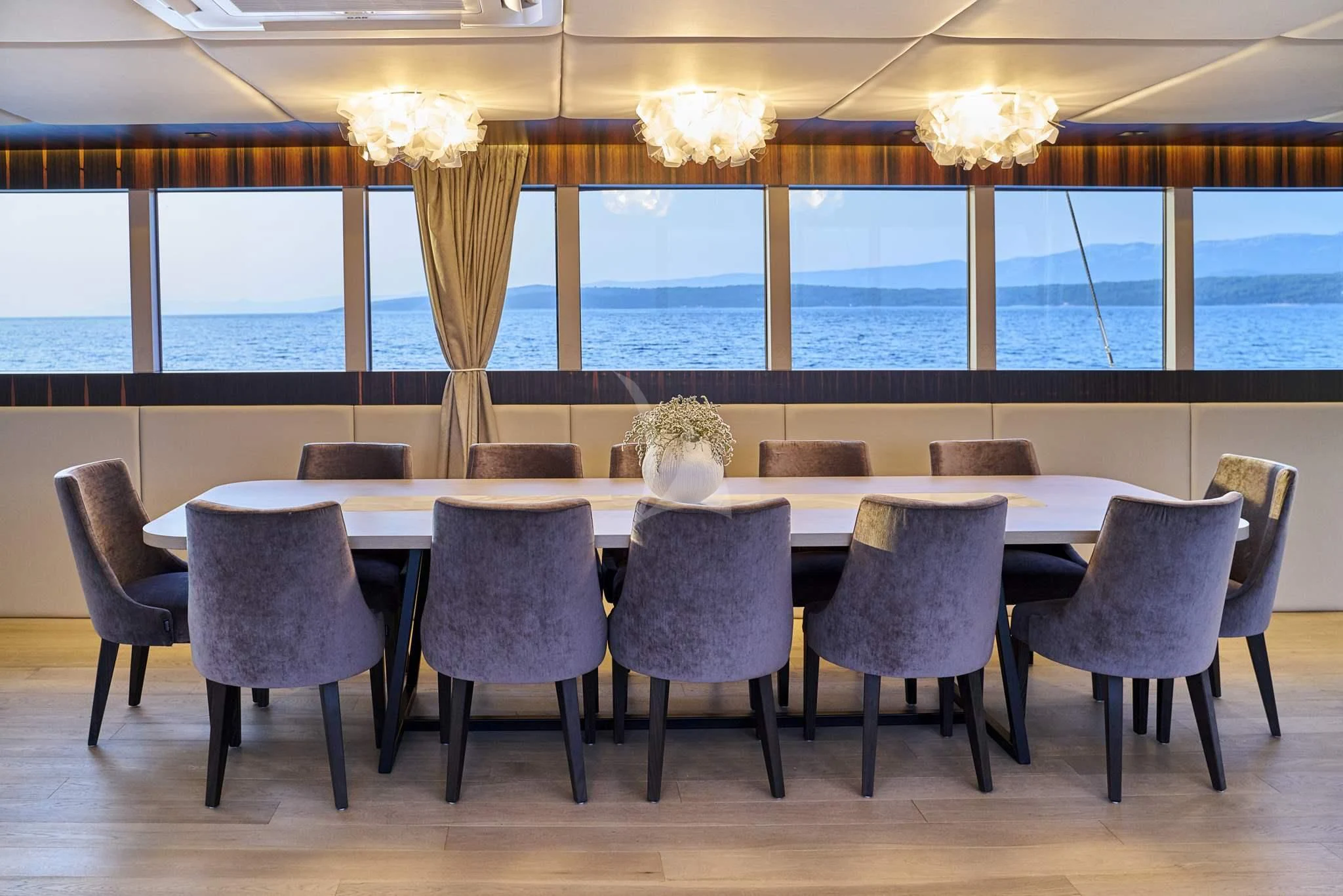 a room with a table and chairs aboard DALMATINO Yacht for Sale