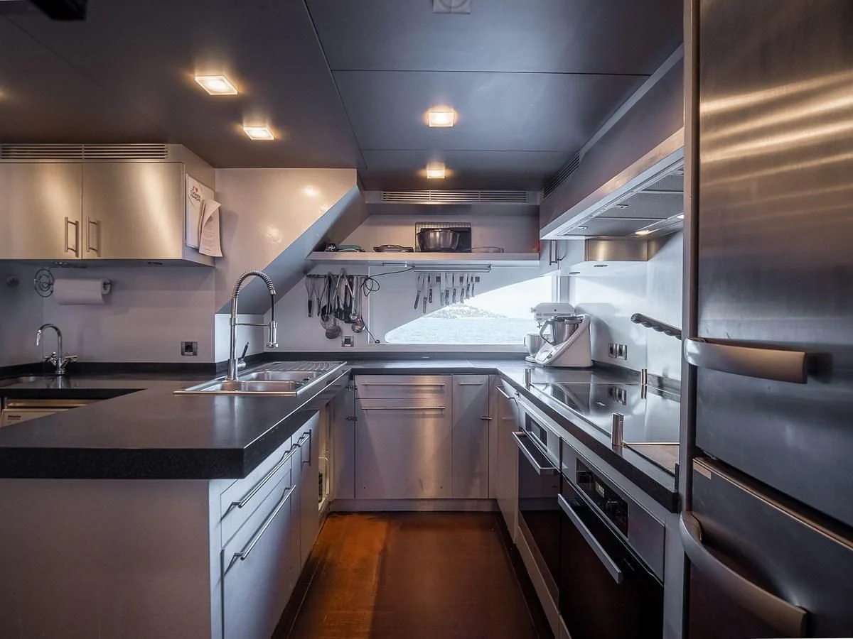 a kitchen with a large island aboard QHT Yacht for Sale