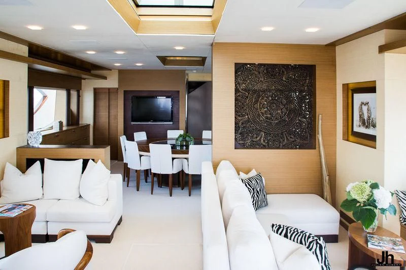 a living room with a couch and a television aboard QHT Yacht for Sale