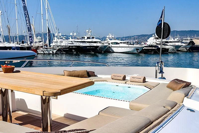 a wooden table on a boat aboard QHT Yacht for Sale