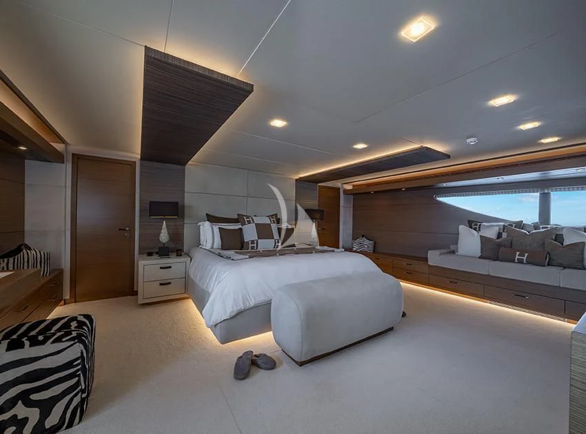 a bedroom with a large bed aboard QHT Yacht for Sale