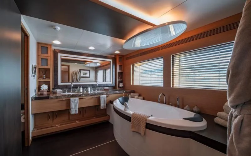 a bathroom with a large bathtub aboard QHT Yacht for Sale