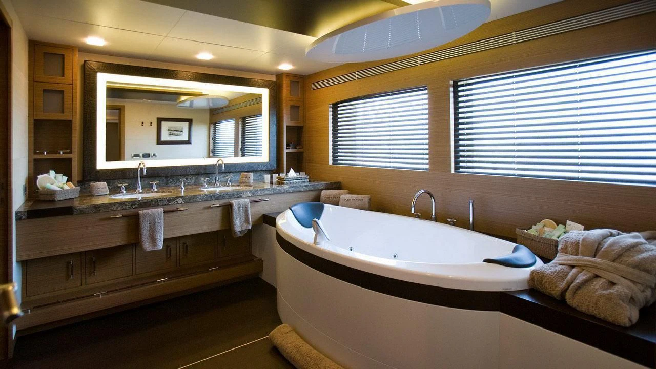 a bathroom with a large bathtub aboard QHT Yacht for Sale